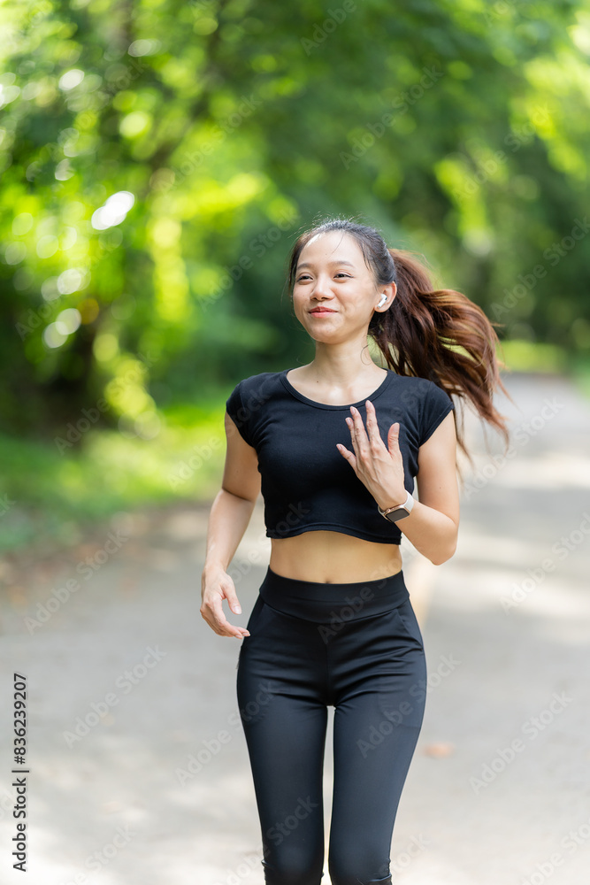 Healthy woman warms up before jogging and relaxes. Stretch your arms and look outside at the road, get in shape at the park before running and enjoy healthy outdoor activities. Healthy woman warms up before jogging and relaxes. Stretch your arms and look outside at the road, get in shape at the park before running and enjoy healthy outdoor activities.