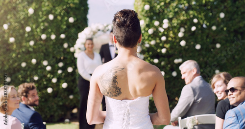 Bride, wedding and walking by aisle with marriage, commitment and love for groom or partner. Woman, ceremony and processional entrance for matrimony, loyalty and union outdoor with audience or crowd