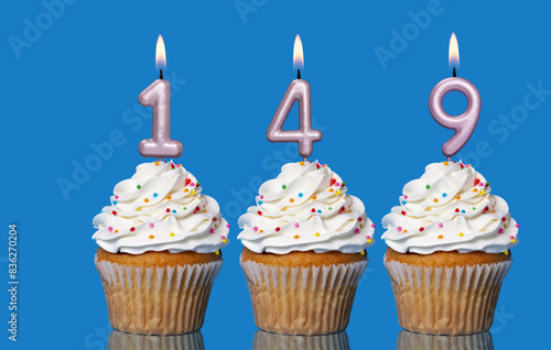 Birthday Cupcakes With Candles Lit Forming The Number 149