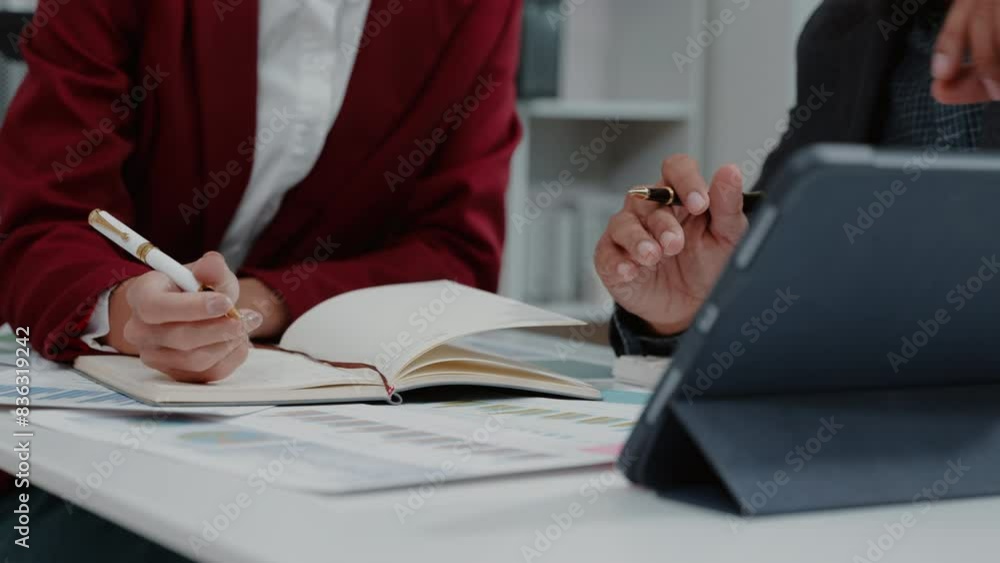 Close up of hand teamwork business group are meeting working calculate and brainstorming about business financial and marketing on tablet paperwork and presentation.