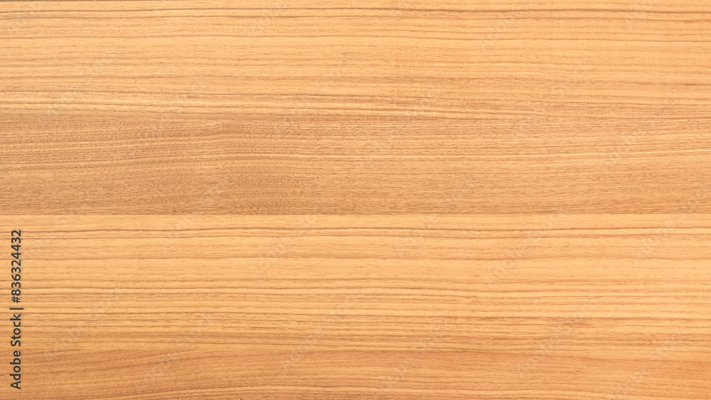 A wooden surface with a grainy texture. The wood is brown and has a natural look. The surface is smooth and has a warm, inviting feel A wooden surface with a grainy texture. The wood is brown and has a natural look. The surface is smooth and has a warm, inviting feel