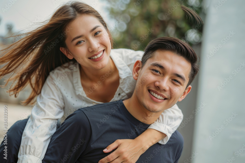 Happy Asian Portrait of young couple in city. They are both happy and enjoying the moment Happy Asian Portrait of young couple in city. They are both happy and enjoying the moment