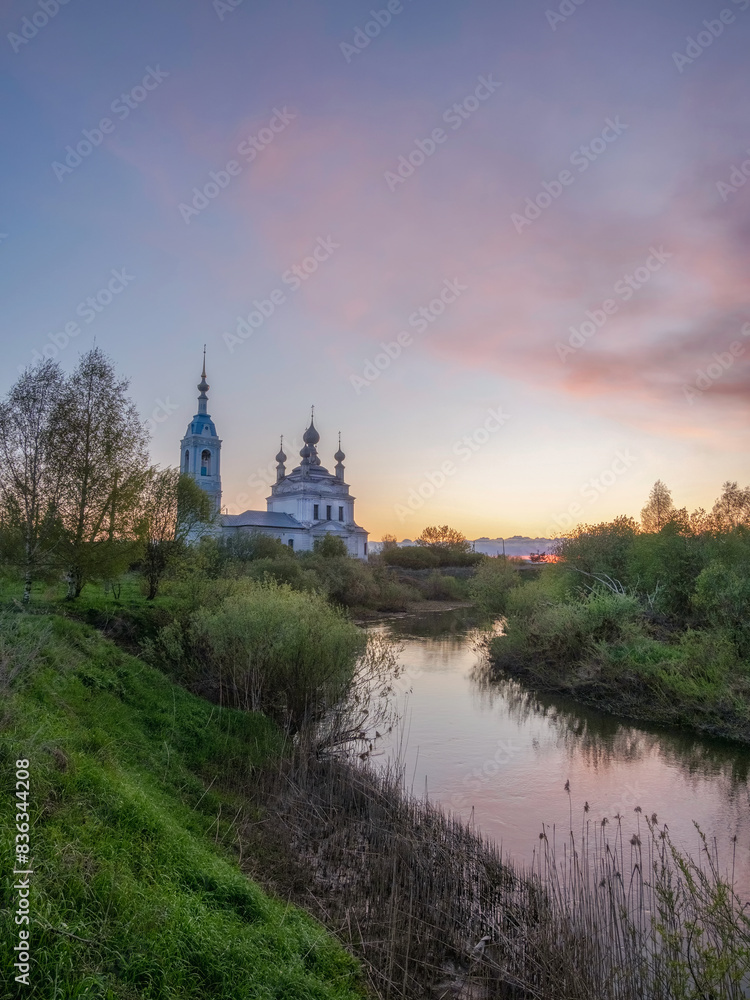 Morning landscape, sunrise on the river with monastery.