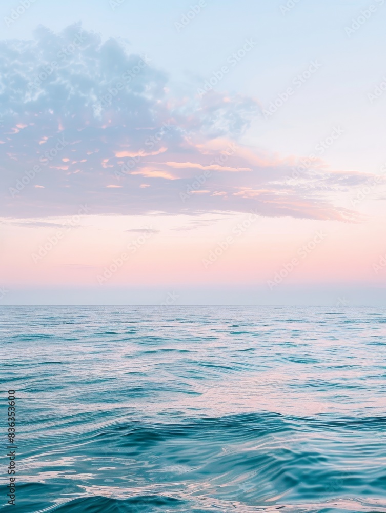 Obraz premium Tranquil Pastel Sunset Over Calm Sea - Serene Seascape with Copyspace.