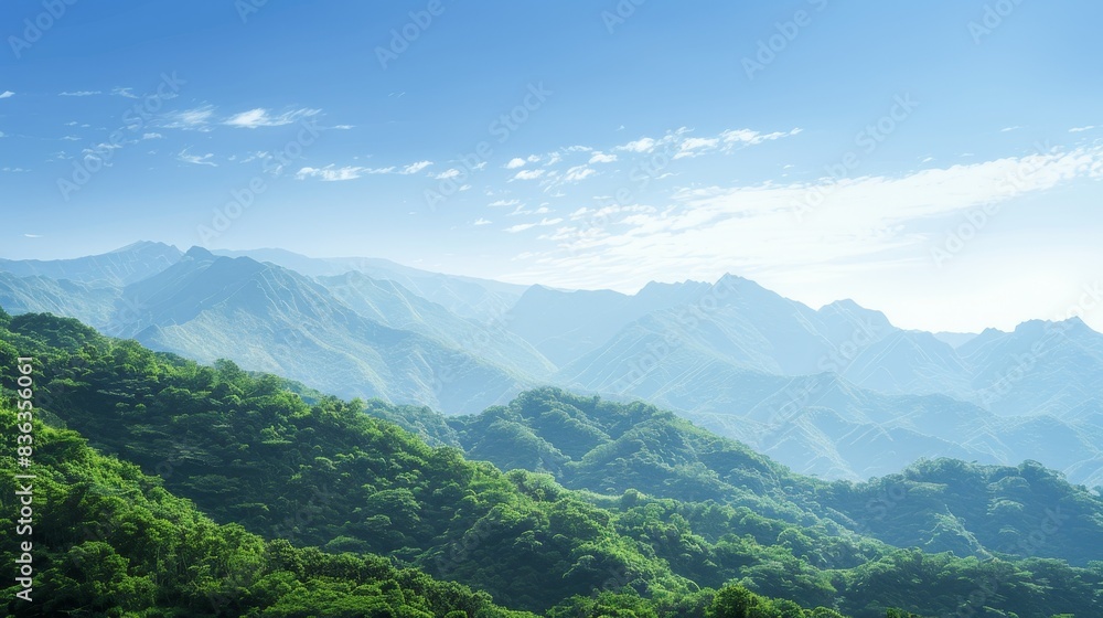 Obraz premium Tranquil Mountain Landscape with Lush Greenery and Clear Blue Sky - Panoramic Nature Scene with Copyspace