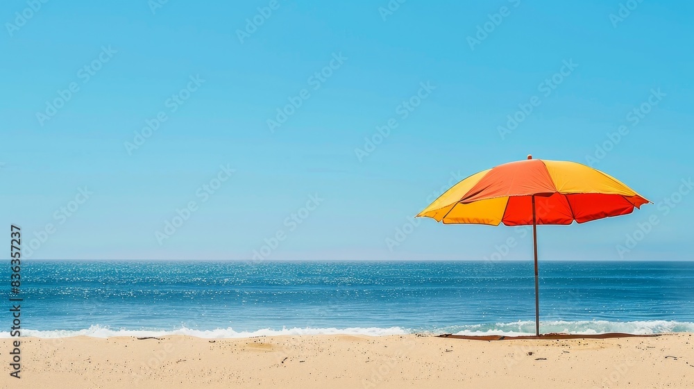 Relaxing Day at the Beach: Colorful Umbrella providing Shade on Sandy Shore with Blue Sky and Calm Waves Relaxing Day at the Beach: Colorful Umbrella providing Shade on Sandy Shore with Blue Sky and Calm Waves