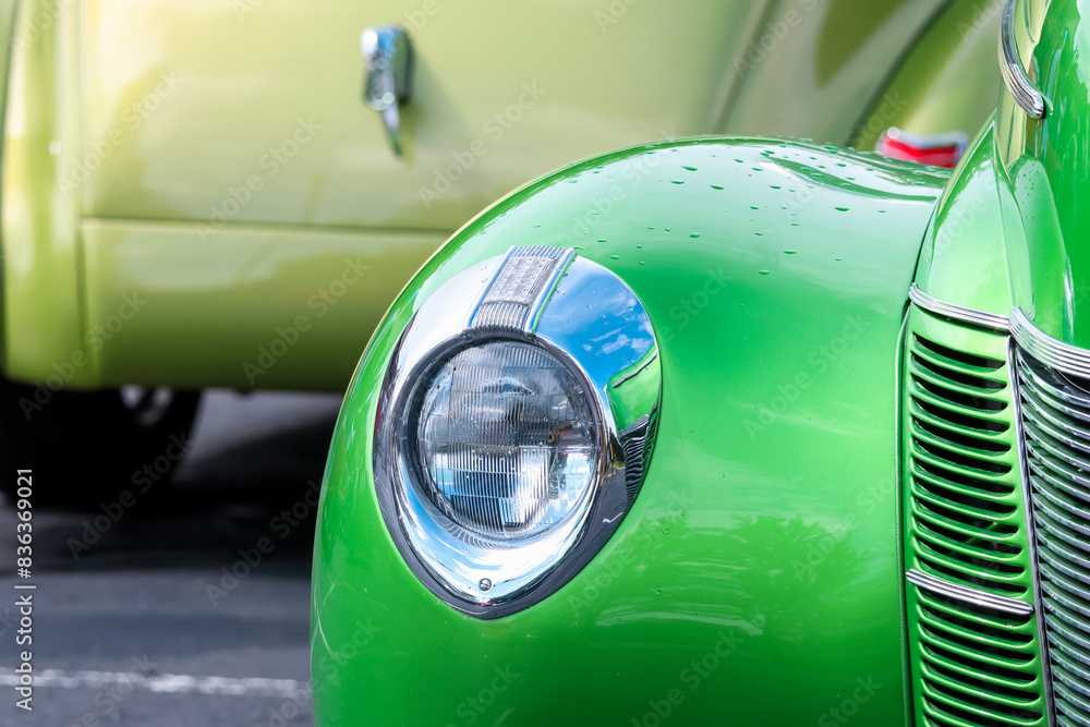 Close up view of Green classic car, head lamp front view. Close up view of Green classic car, head lamp front view.