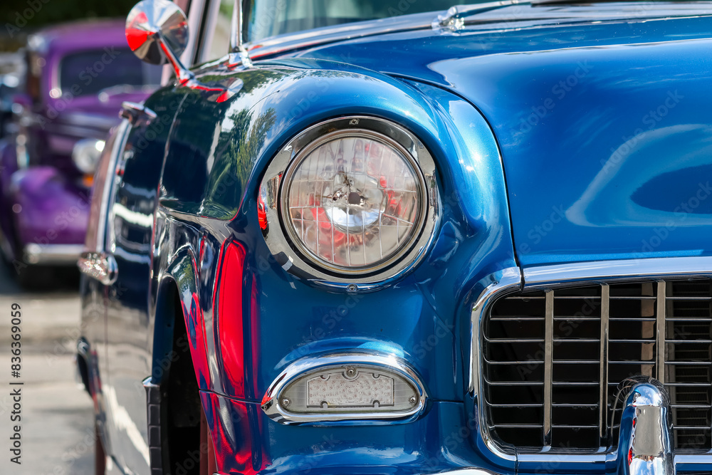 Close up view of blue classic American muscle car. Close up view of blue classic American muscle car.