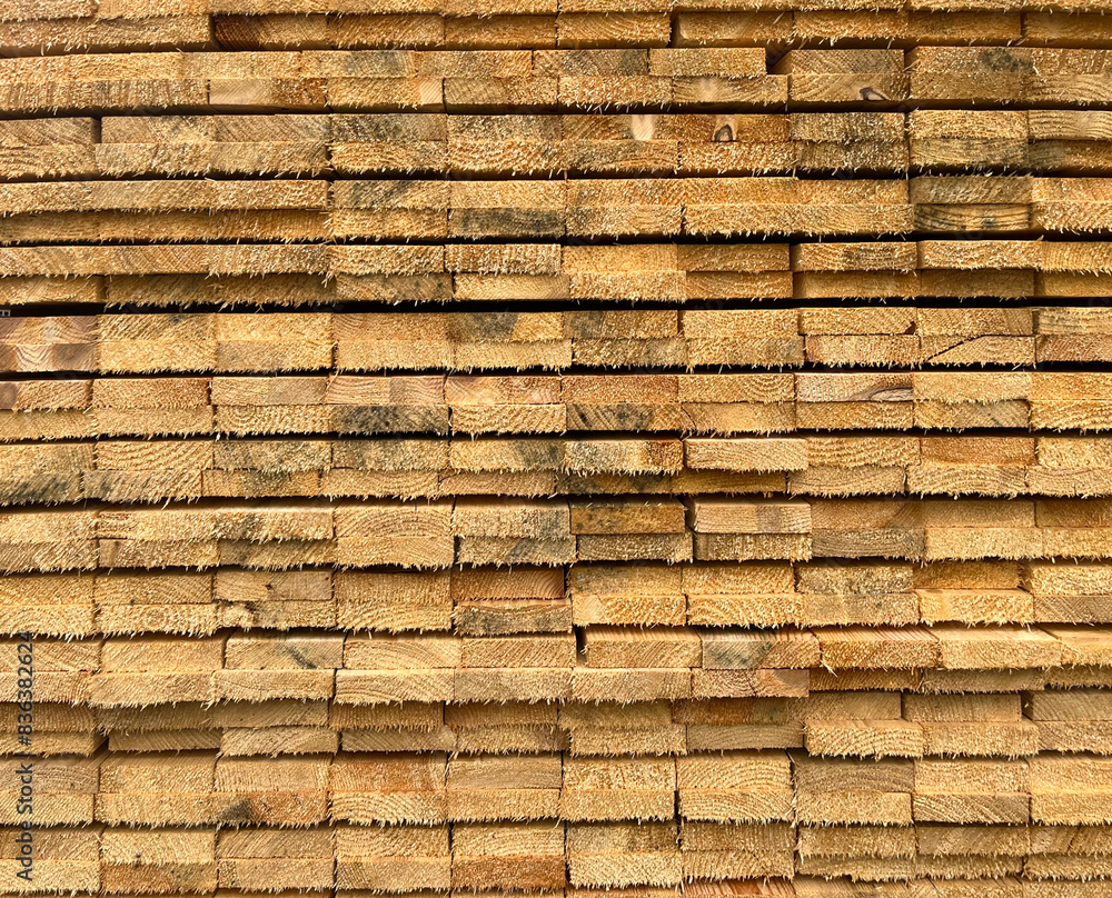 Background of folded cut wooden boards lying in a warehouse for making pallets Background of folded cut wooden boards lying in a warehouse for making pallets