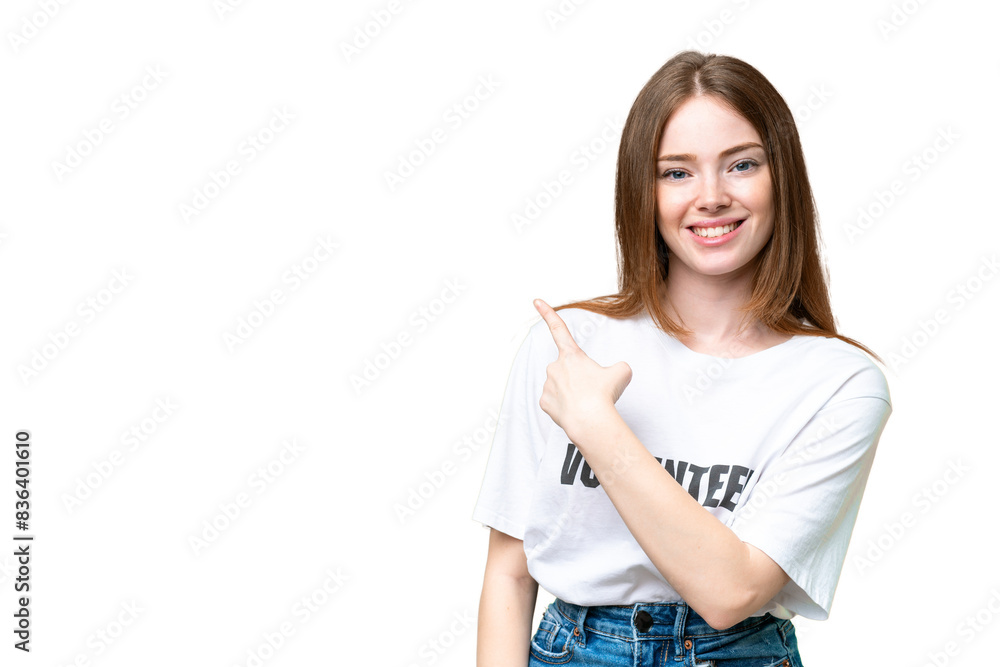 Young volunteer woman over isolated chroma key background pointing to the side to present a product Young volunteer woman over isolated chroma key background pointing to the side to present a product