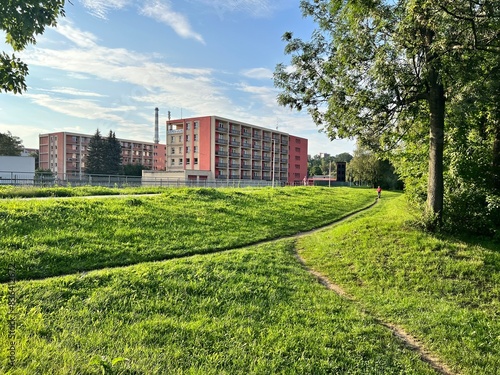 path in the grass on the outskirts of the town of Místek photo