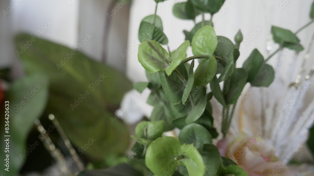 synthetic flowers that resemble real flowers for room decoration. Photo of a beautiful blooming flower plant taken in close-up and selected focus synthetic flowers that resemble real flowers for room decoration. Photo of a beautiful blooming flower plant taken in close-up and selected focus
