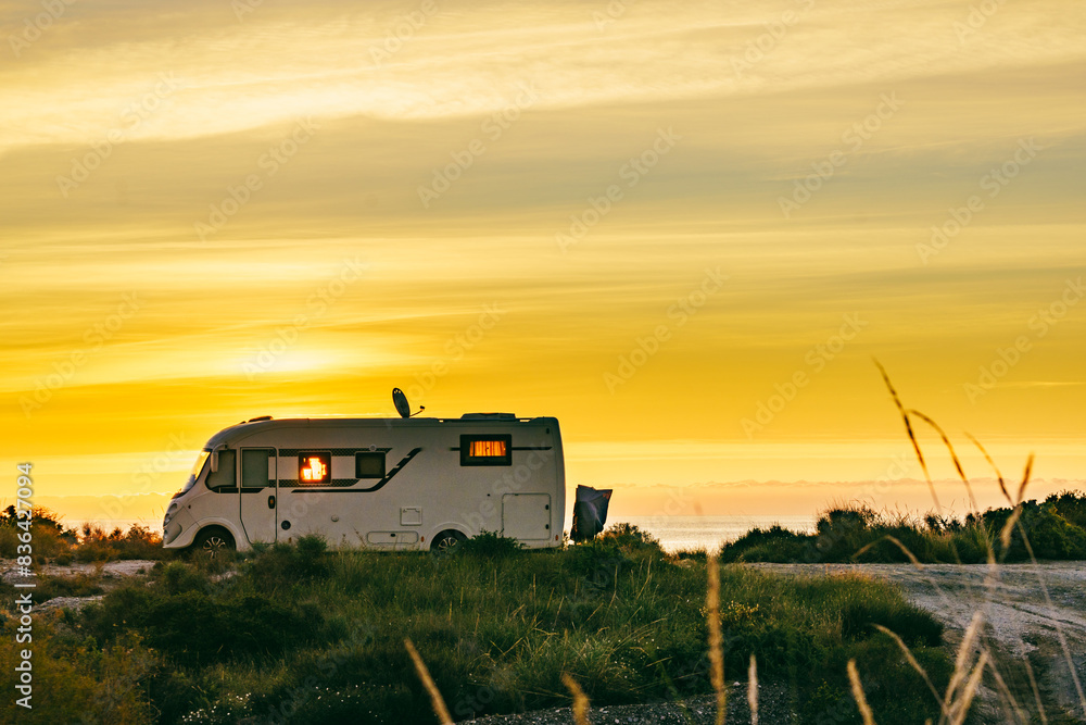 Fototapeta premium Caravan on nature in the morning at sunrise