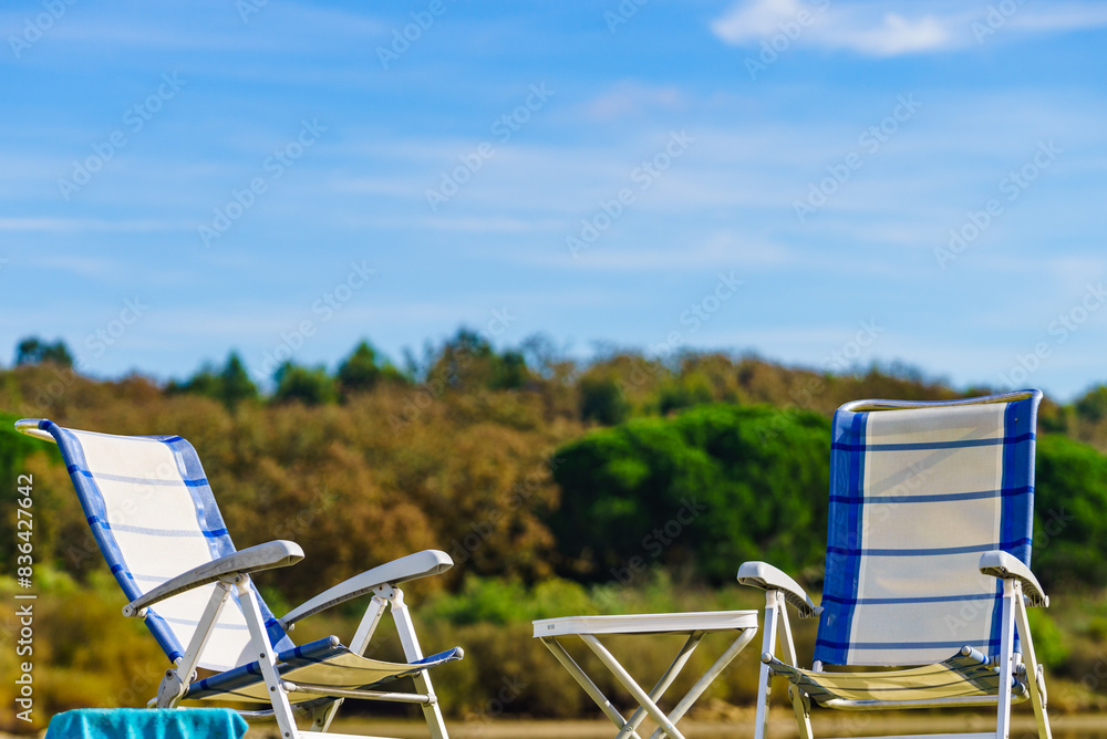 Two empty camp chairs on nature Two empty camp chairs on nature