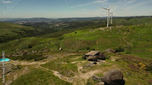 Aerial video above Casa do Penedo Boulder House in Fafe, Portugal