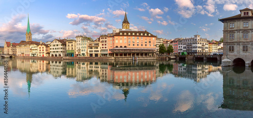 Panoramic view of Zurich waterfront with reflections of Fraumunster and St Peters Church, Switzerland