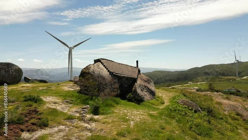 Aerial video above Casa do Penedo Boulder House in Fafe, Portugal