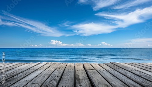 A wooden pier overlooking a calm blue ocean