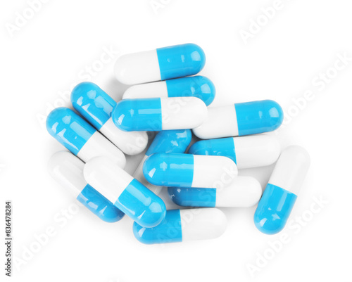 Pile of antibiotic pills isolated on white, top view