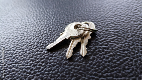 The key is silver with a black background.