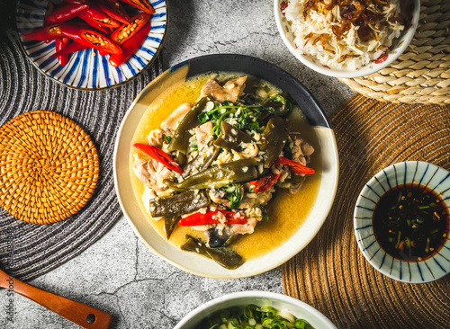 Stir fried chicken with taxiang served in plate isolated on grey background top view of assorted taiwan food photo