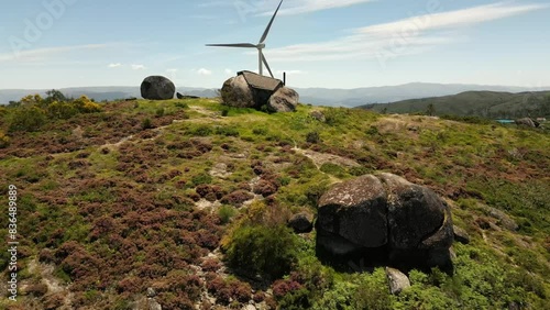 Aerial video above Casa do Penedo Boulder House in Fafe, Portugal