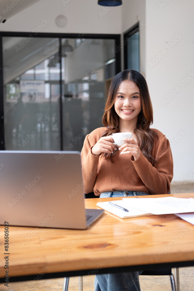 Young woman coffee shop owner holds an open sign. Young woman coffee shop owner holds an open sign.