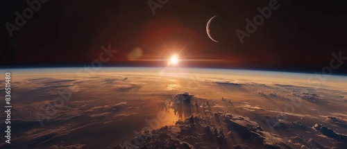 An eclipse casts a long shadow on the sunrise Earth, set against the vast backdrop of deep space. The scene is bathed in serene colors, creating a peaceful and awe-inspiring dawn.