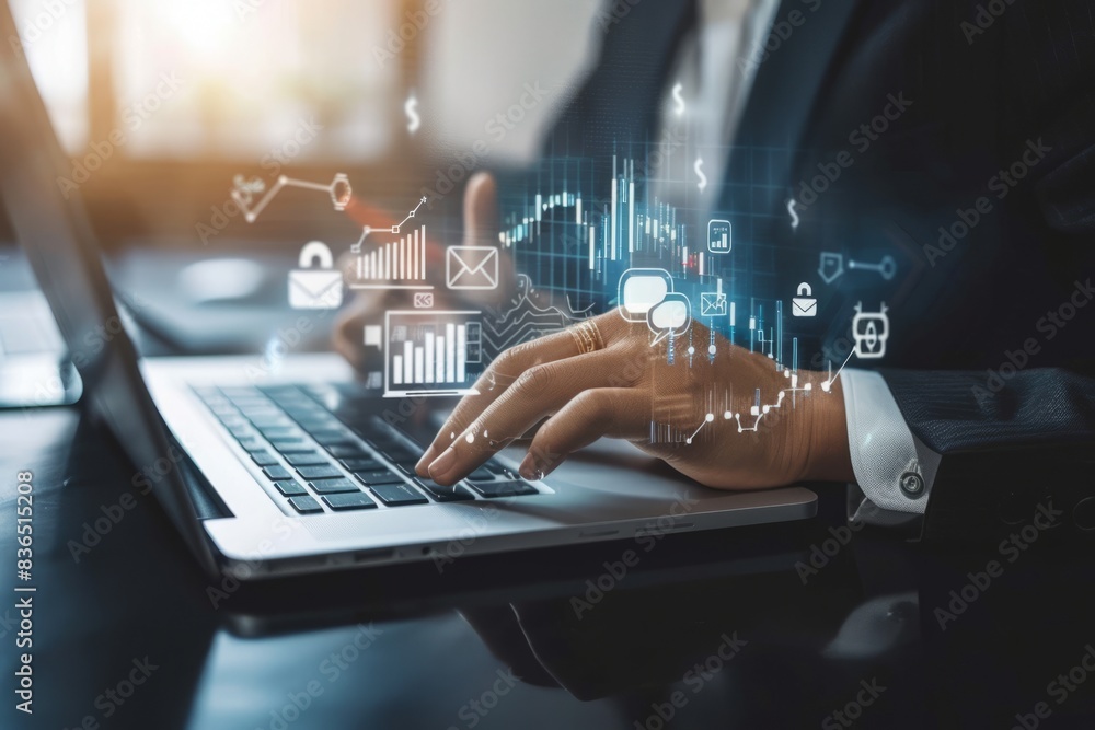 Naklejka premium The businessman's hand uses a laptop, pointing to a virtual screen of money bag ICONS, charts or financial development charts, budgets and financial planning concepts.