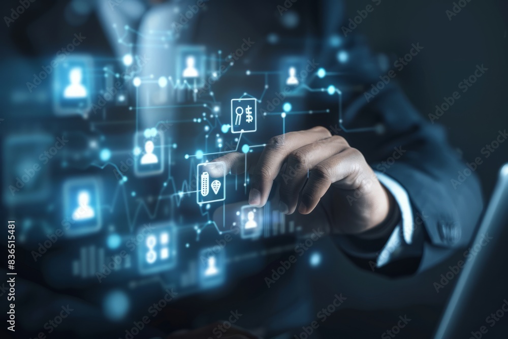 The businessman's hand uses a laptop, pointing to a virtual screen of money bag ICONS, charts or financial development charts, budgets and financial planning concepts. The businessman's hand uses a laptop, pointing to a virtual screen of money bag ICONS, charts or financial development charts, budgets and financial planning concepts.