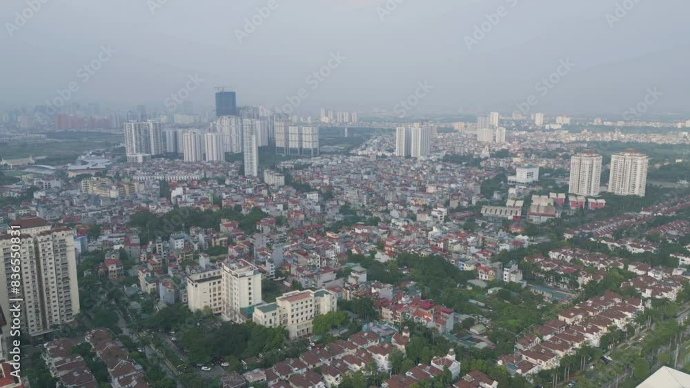 Aerial view of residential neighborhood roofs. Urban housing development from above. Top view. Real estate in Hanoi City, Vietnam. Property real estate. Aerial view of residential neighborhood roofs. Urban housing development from above. Top view. Real estate in Hanoi City, Vietnam. Property real estate.