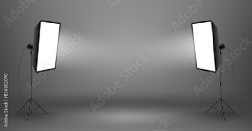 Two glowing softboxes on dark background