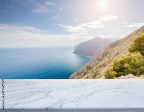 A white marble tabletop overlooking the sea with mountanis in a sunny summer day. Mockup, space for your product photo