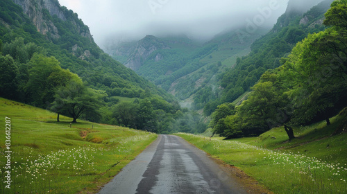 A roadway twists amid mountain peaks.