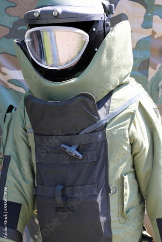 Soldier of bomb squad with the helmet and visor and bulletproof vest during the inspection photo