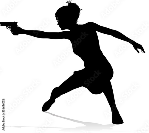 An action hero female movie star woman in silhouette. In a hitman, spy or secret agent detective type role halding a hand gun.