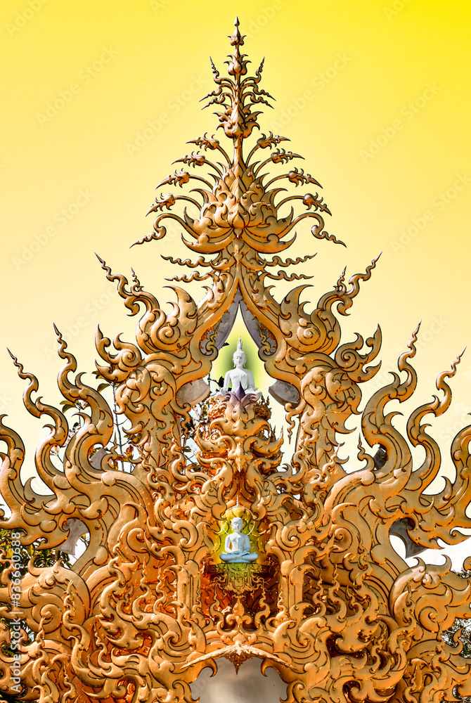 Golden stucco art in a beautiful Thai Buddhist style