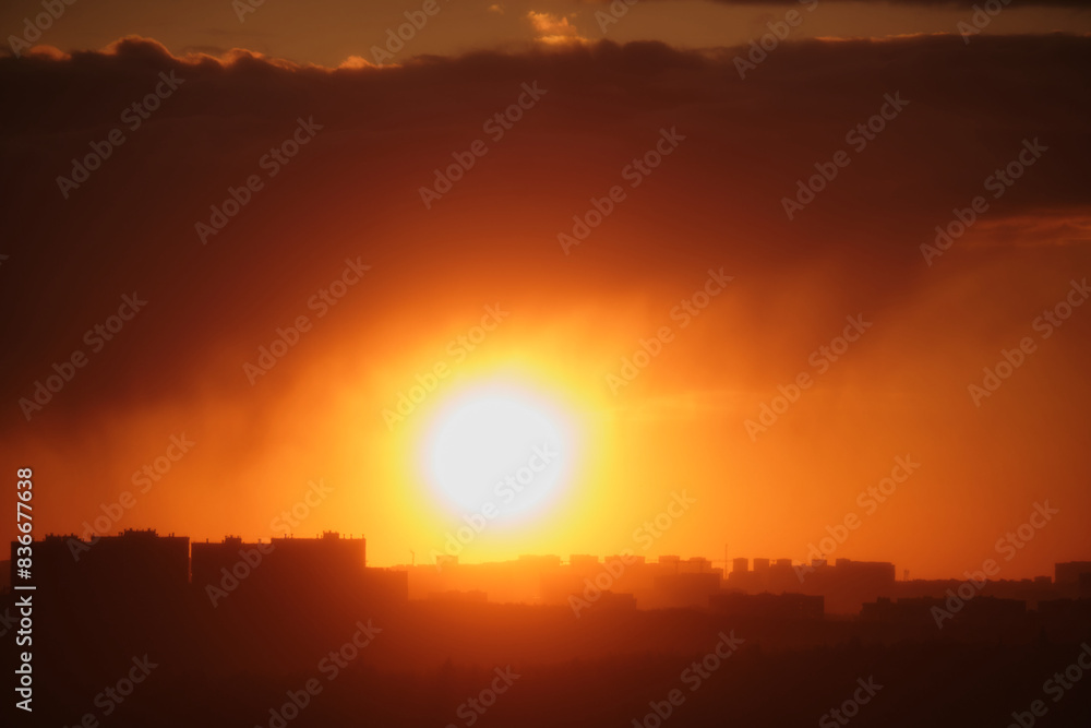 The red clouds illuminated by the setting sun created a beautiful scene above the urban skyline.