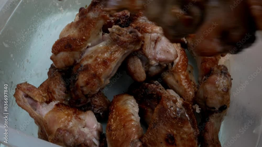 Grilled chicken wings on a plate close up Grilled chicken wings on a plate close up