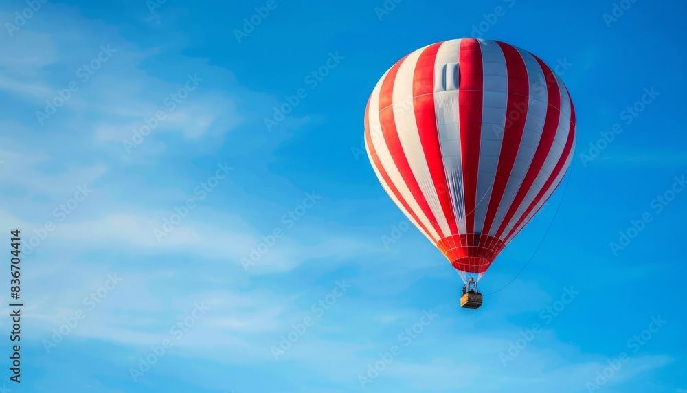 Obraz premium Cruising the Skies: Stunning Red and White Hot Air Balloon Soaring over Budapest, Hungary on a Clear