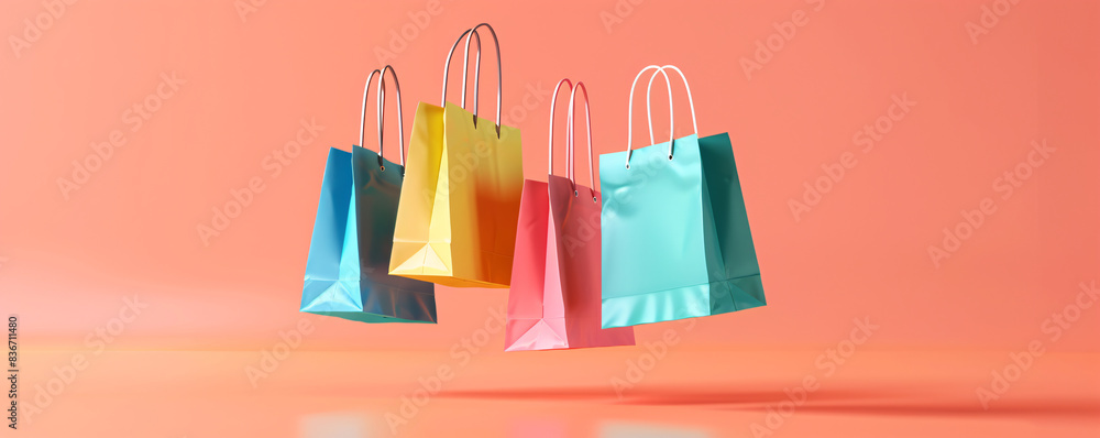 Vibrant paper bags floating in the air with a warm coral background ...