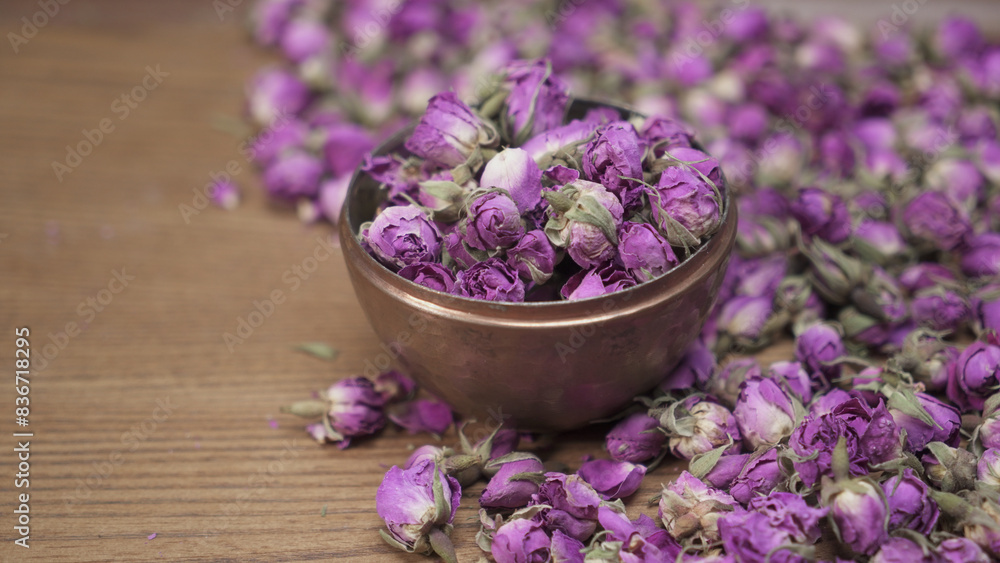 Bowl of dried rose buds, on the table Bowl of dried rose buds, on the table