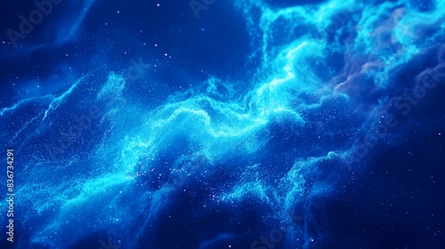 Abstract image of bright blue swirling nebula with sparkling particles in deep space.