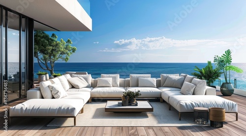 Un luxueux espace extérieur avec un canapé d'angle avec coussins, terrasse en bois, surplombant l'océan. © David Giraud