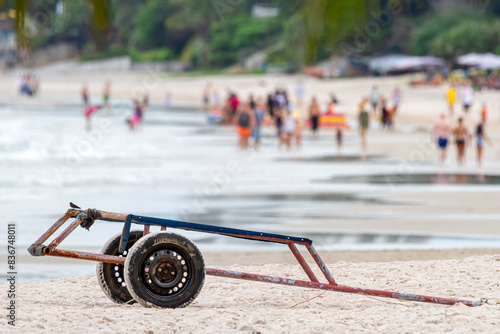 Abandoned Cart on a Crowded Beach