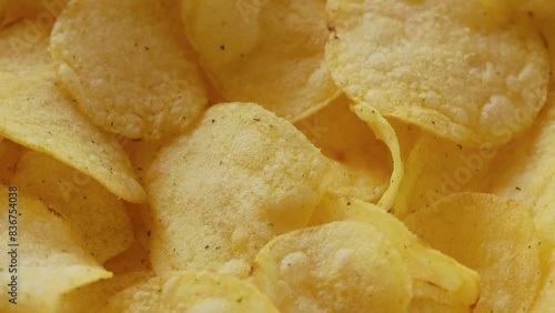 Fast food snacks. Potato chips rotating close up. Potato snack for unhealthy fast food