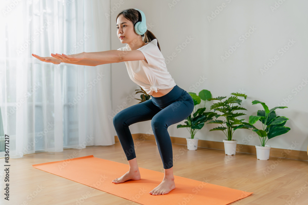 Fototapeta premium woman doing exercise yoga plank at home.