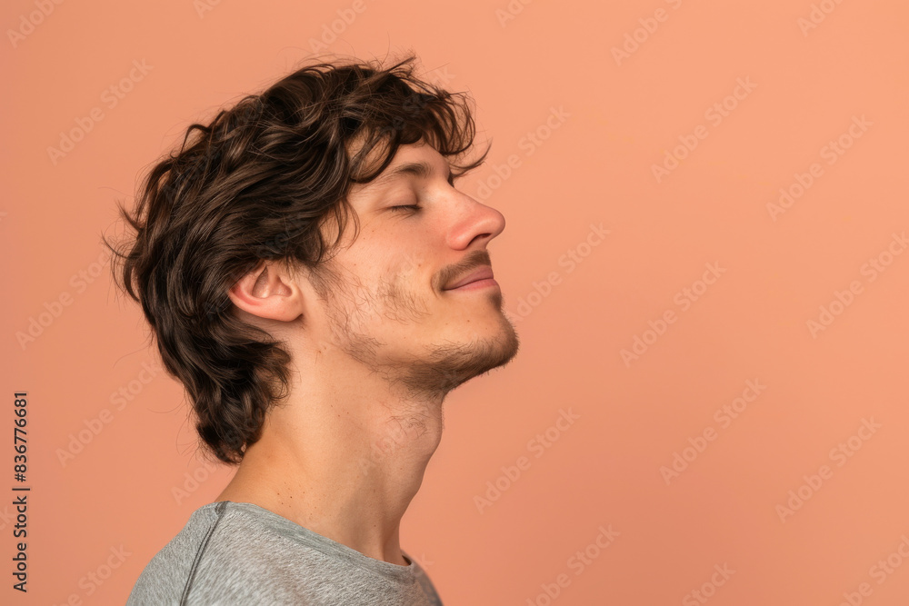 Fototapeta premium A close up of a man with beard and closed eyes looking to a side