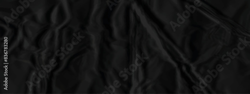 Black crumpled paper texture . Wrinkled paper texture. Black paper texture . Black crumpled and top view textures can be used for background of text or any contents .