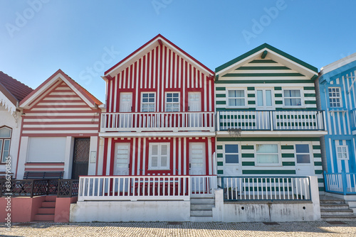 Facades of colorful fisheman houses in Costa Nova, Aveiro, Portugal